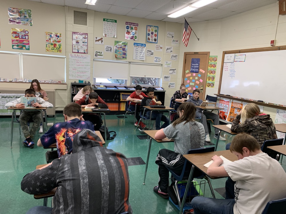 Middle School students reading in Mrs. Dean's room.